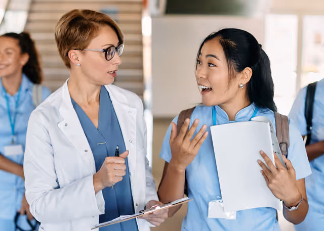 Nurse trainee and trainer having a chat