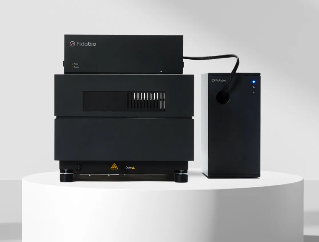 Black Fidabio scientific instrument with two connected units displayed on a white circular platform.