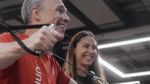 A personal trainer with their client
