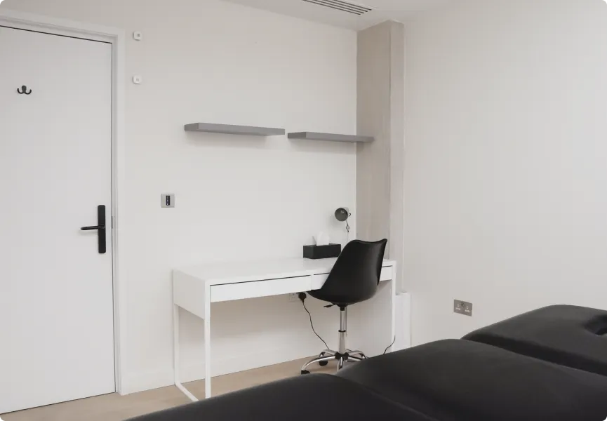 A treatment room with desk