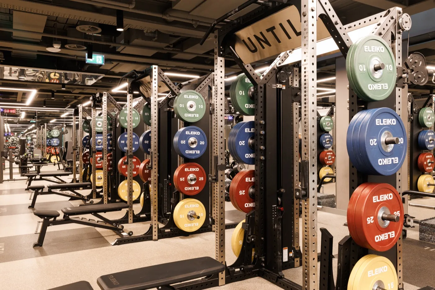 Squat racks loaded with Eleiko plates on the gym floor at UNTIL Marylebone
