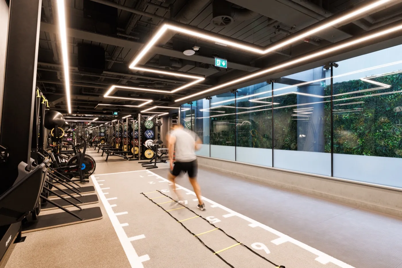 Sprint and agility track alongside cardio machines and a living green wall at UNTIL Marylebone