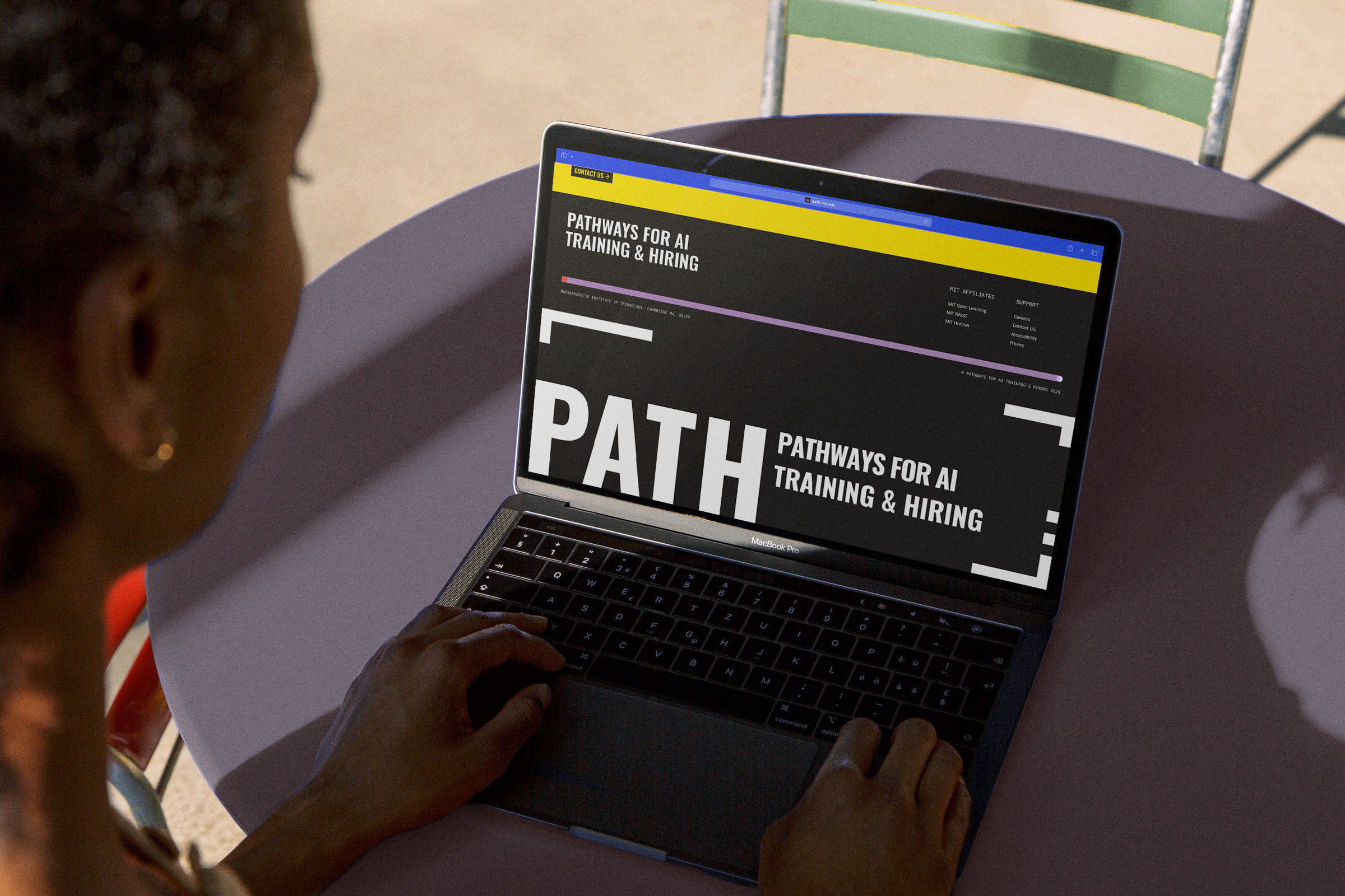 Woman reading PATH website on laptop