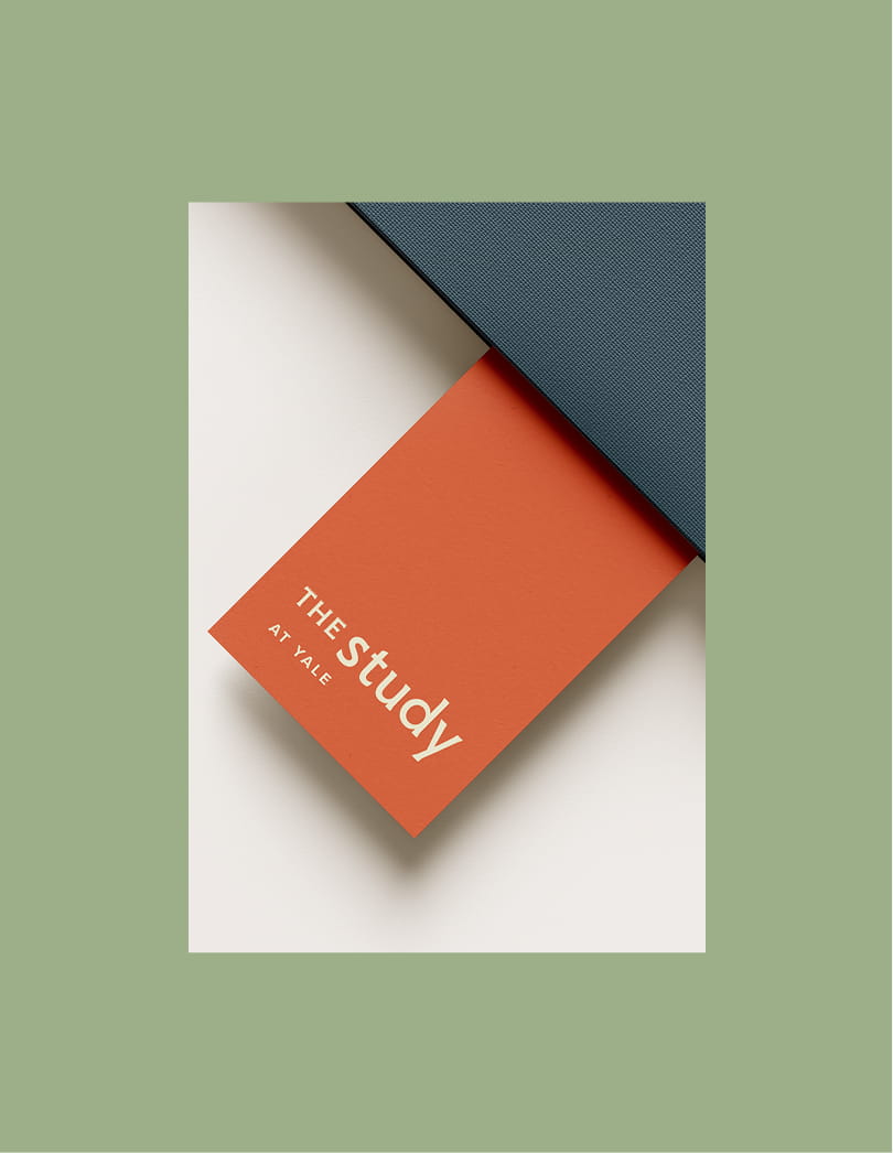 Rich orange bookmark for The Study at Yale, set against mint background