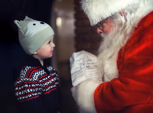 A child talking to Santa Claus