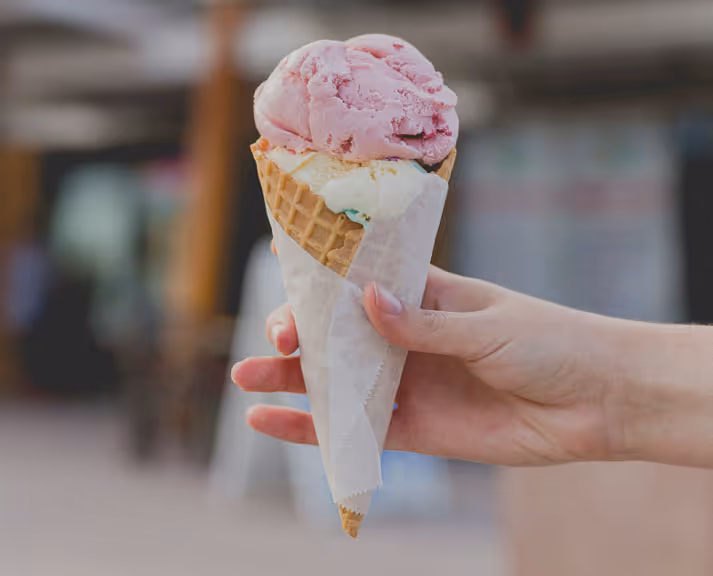 Strawberry ice cream on a cone