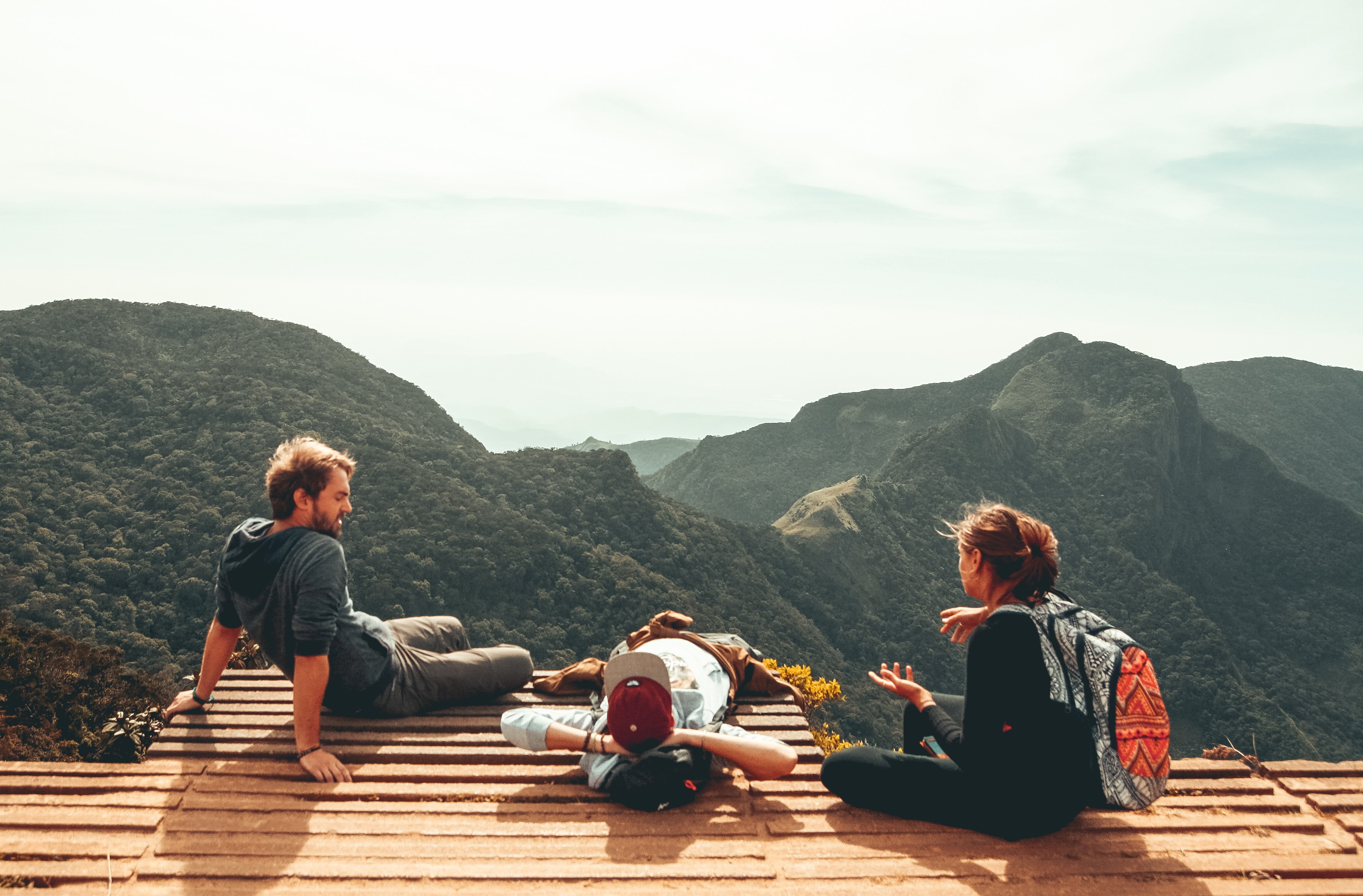 Friends taking a break from hiking 