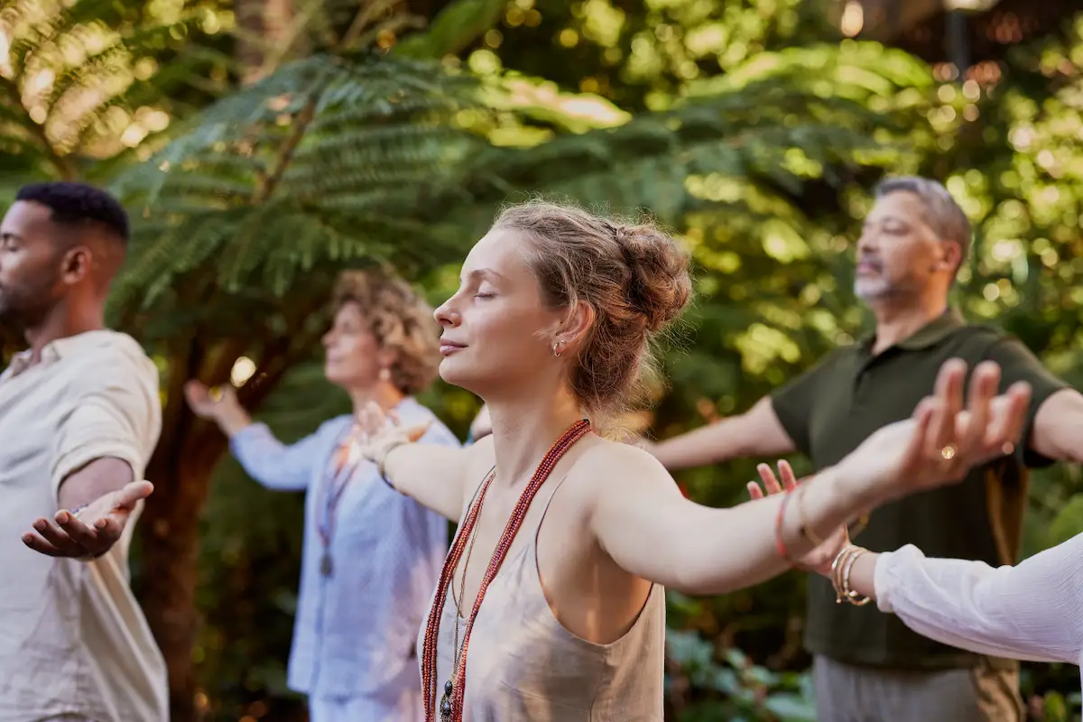 Practitioner leading a integrative practice for her clients in a nature-friendly location