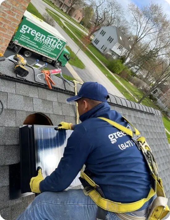 Green Attic Worker Installing Powered Vents