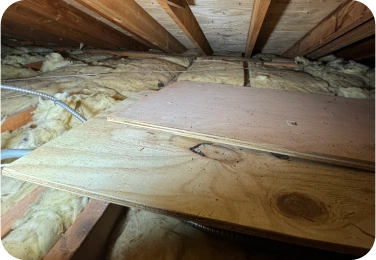Attic Floor With Fiberglass Batts Underneath