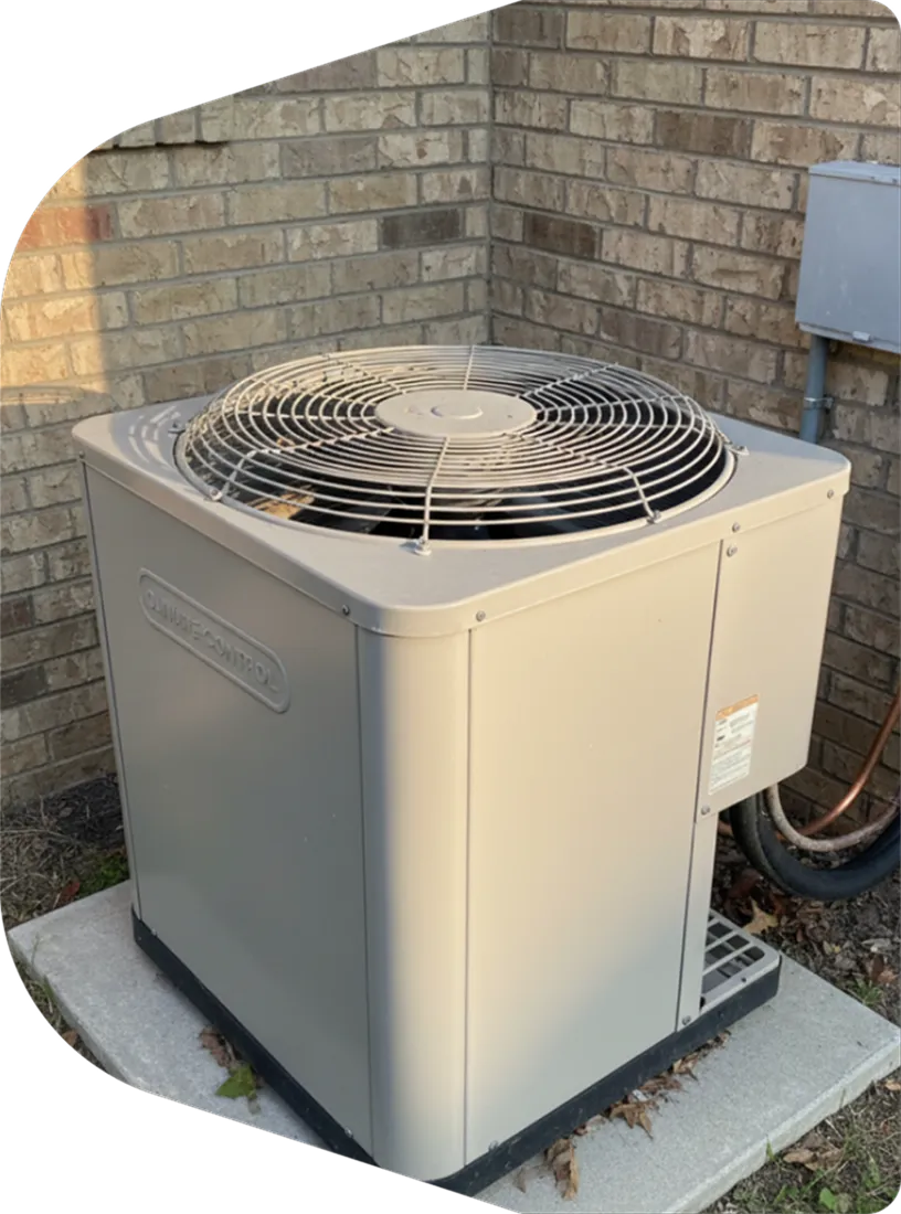 Outdoor air conditioner and heat pump unit installed beside a brick home