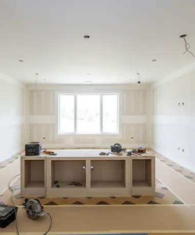Kitchen remodeling project with new cabinets and floors being installed
