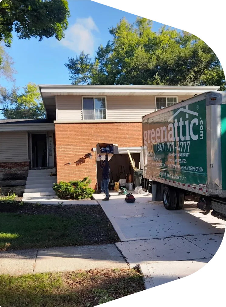 Green Attic Insulation truck parked outside a Chicago home for a house insulation upgrade