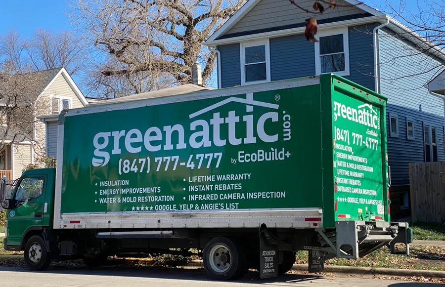 Green Attic insulation service truck parked on a residential street in Chicagoland