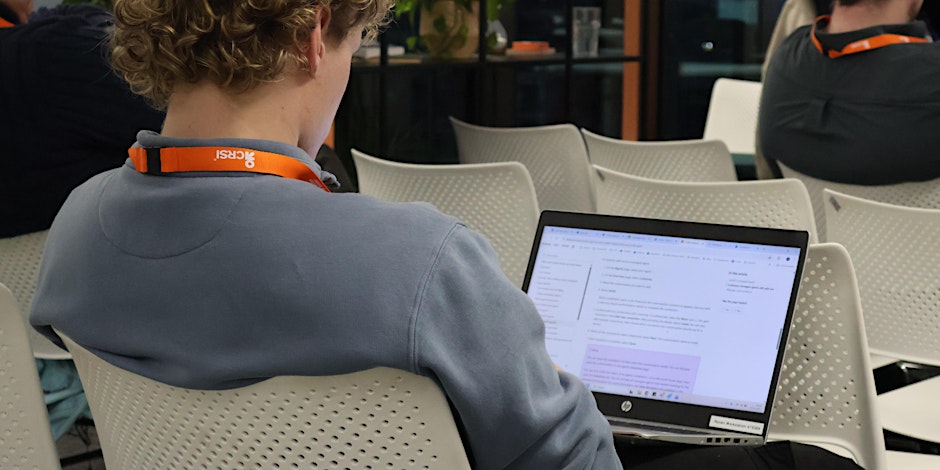 A woman and a man sitting and having a discussion about technology