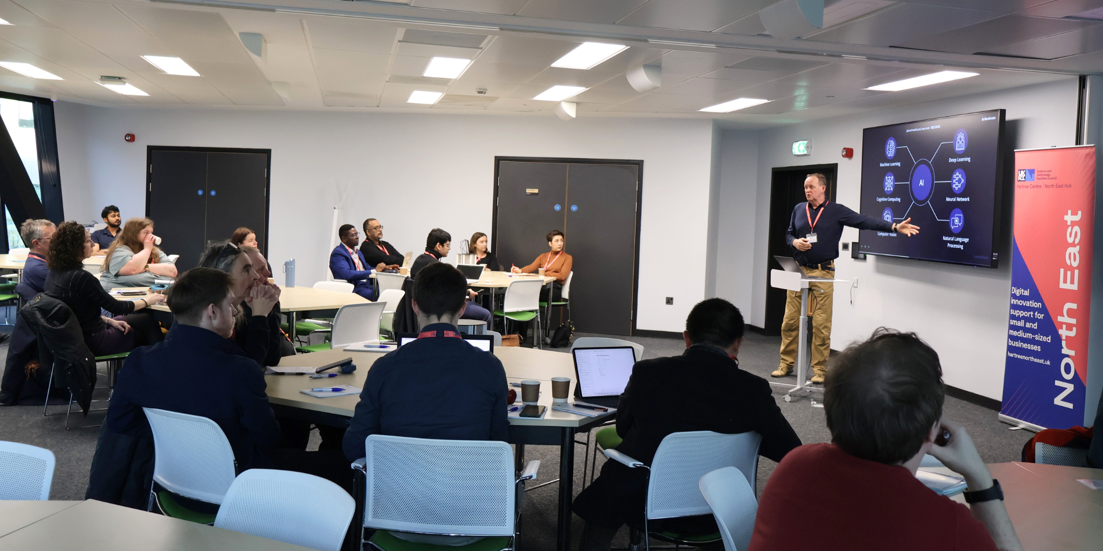 A woman and a man sitting and having a discussion about technology