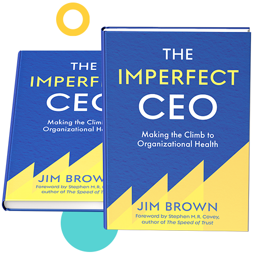 Two copies of The Imperfect CEO by Jim Brown with designs around the books