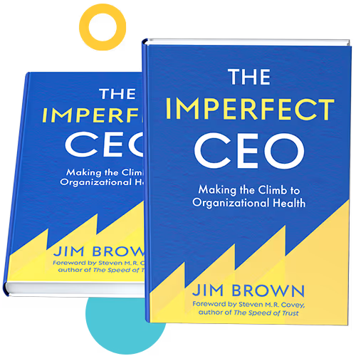 Two copies of The Imperfect CEO by Jim Brown with designs around the books
