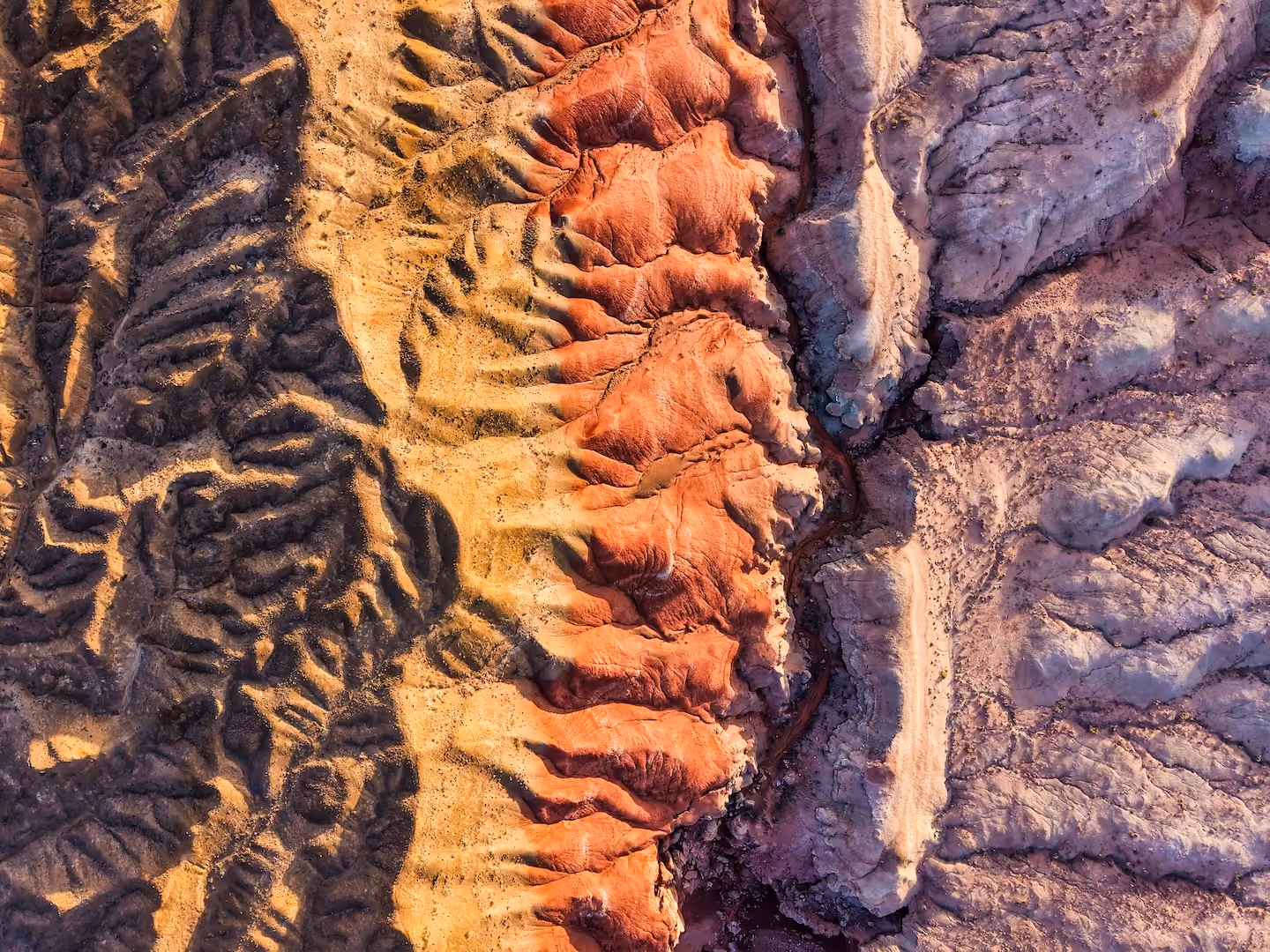 Colourful mountains with geological patterns aerial view