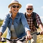 older couple riding a bicycle