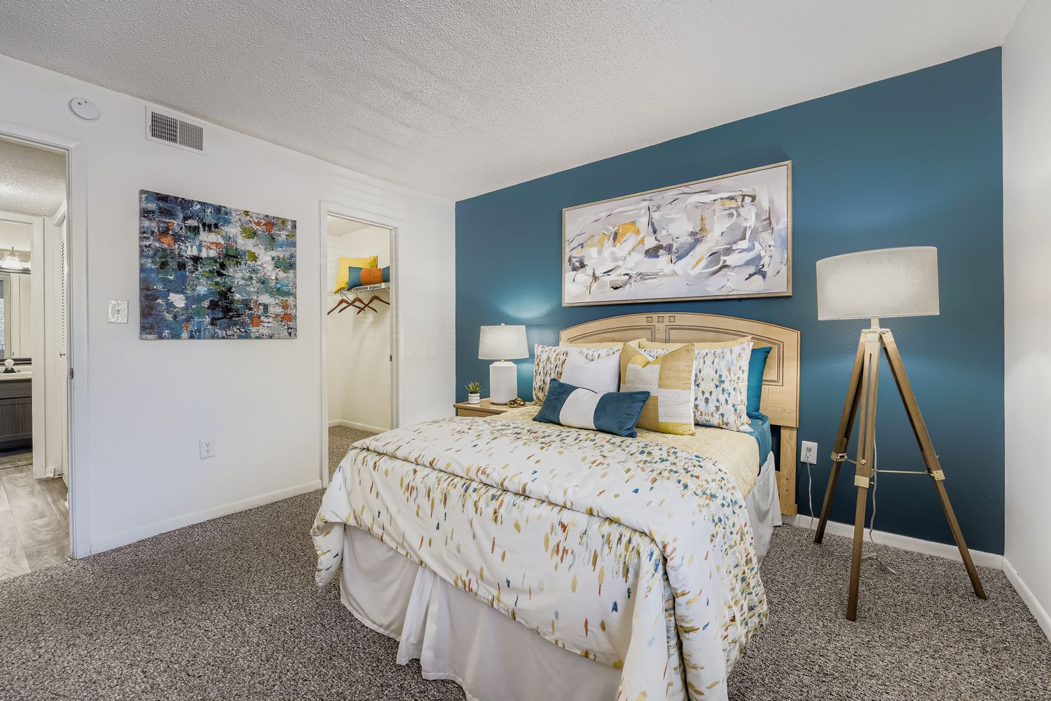 bedroom with bed, dresser, and closet