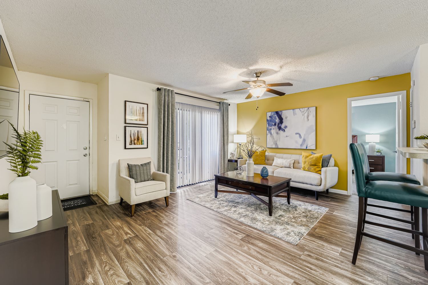 View of furnished living area, dining room, and kitchen