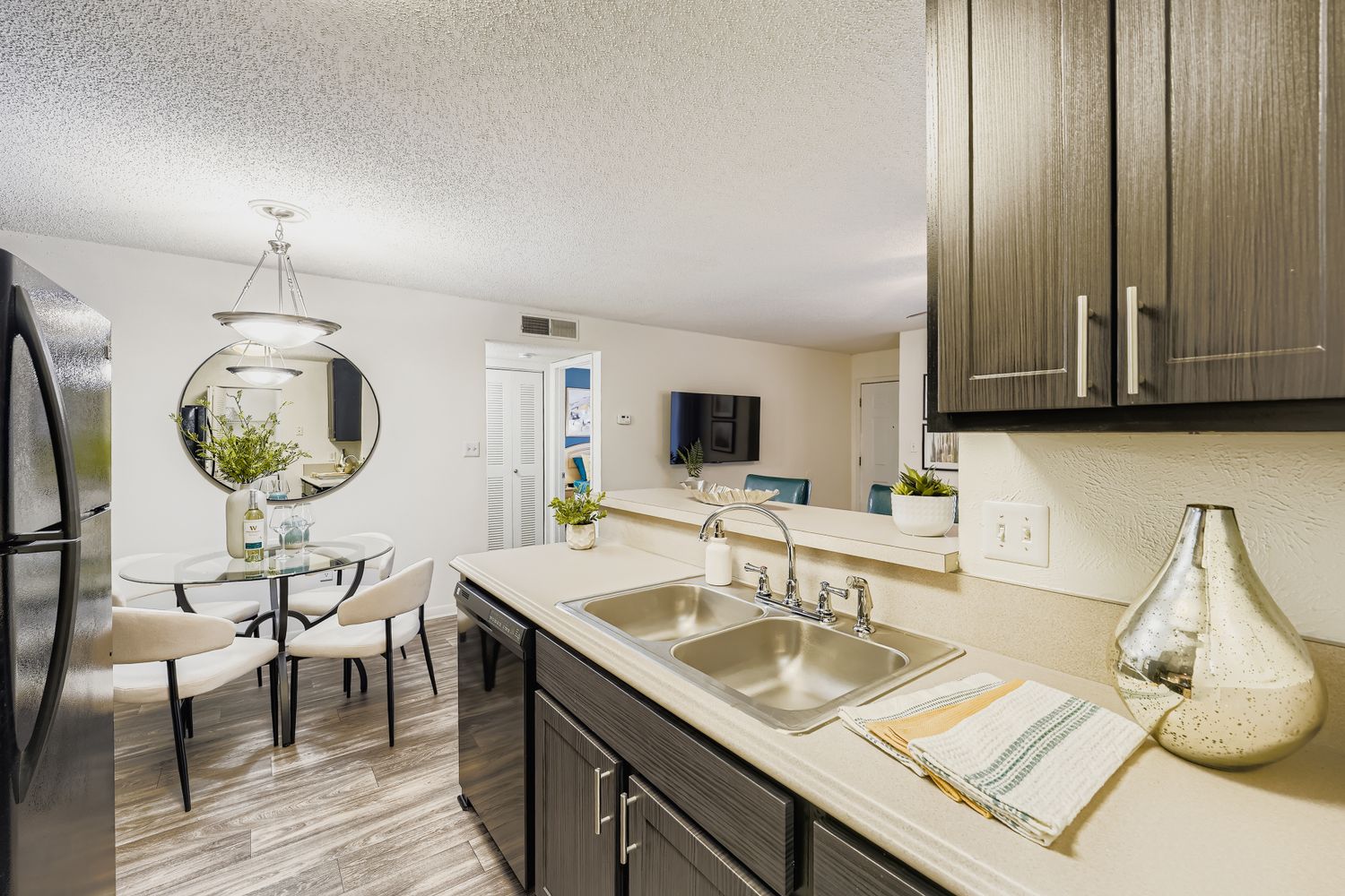 view of kitchen and dining room with table and chairs