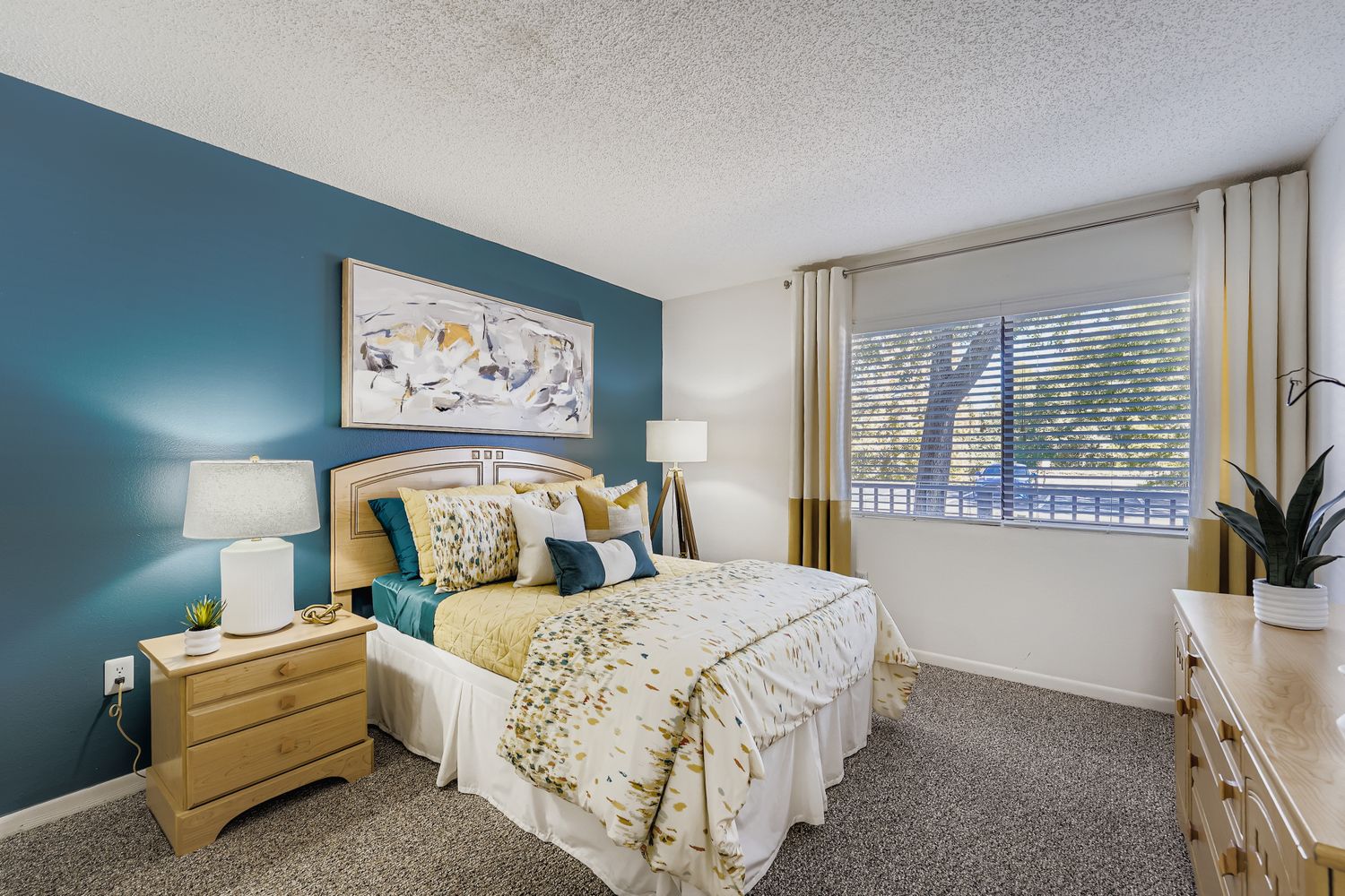 bedroom with bed,side tables, and lamps