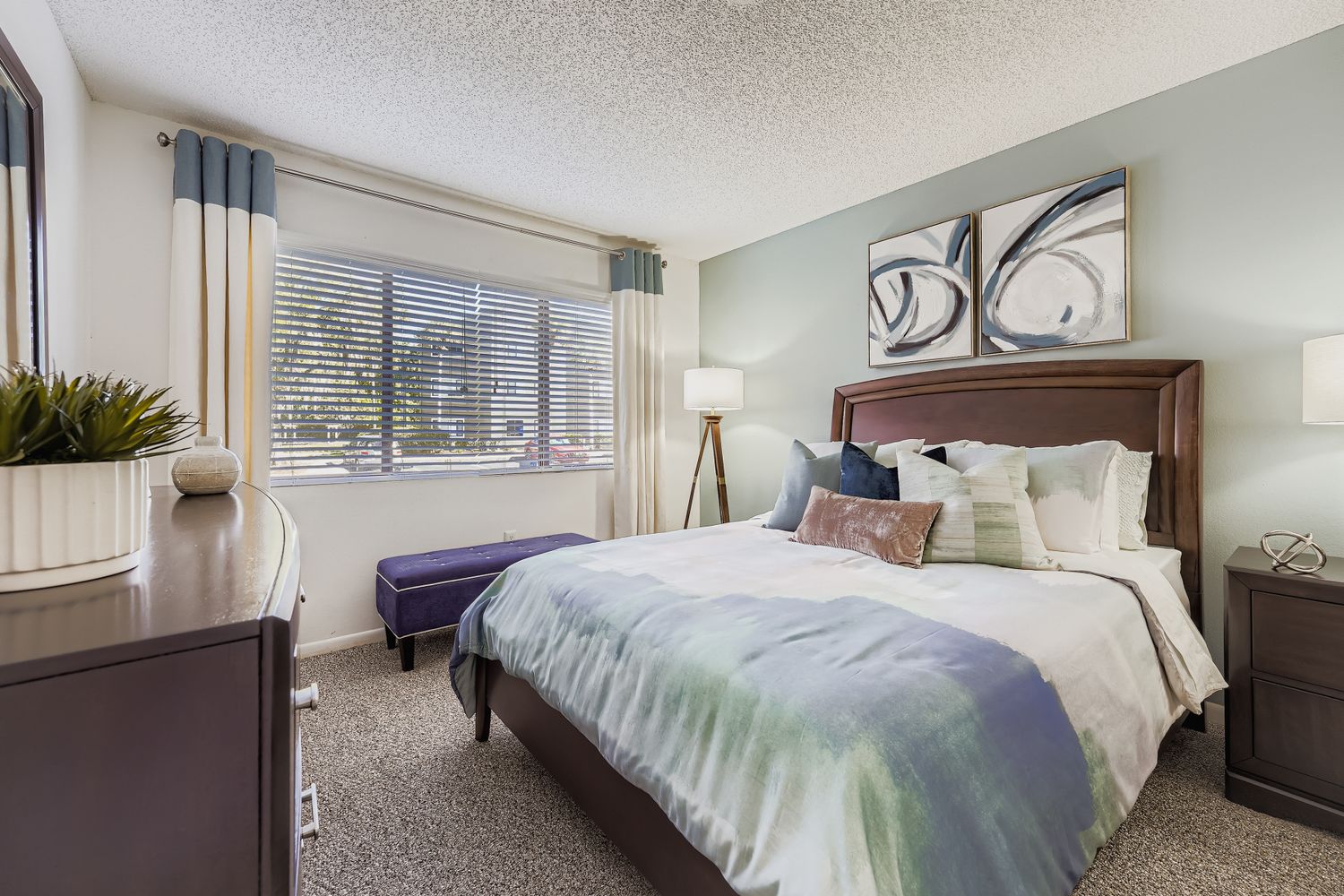 bedroom with bed,side tables, and lamps