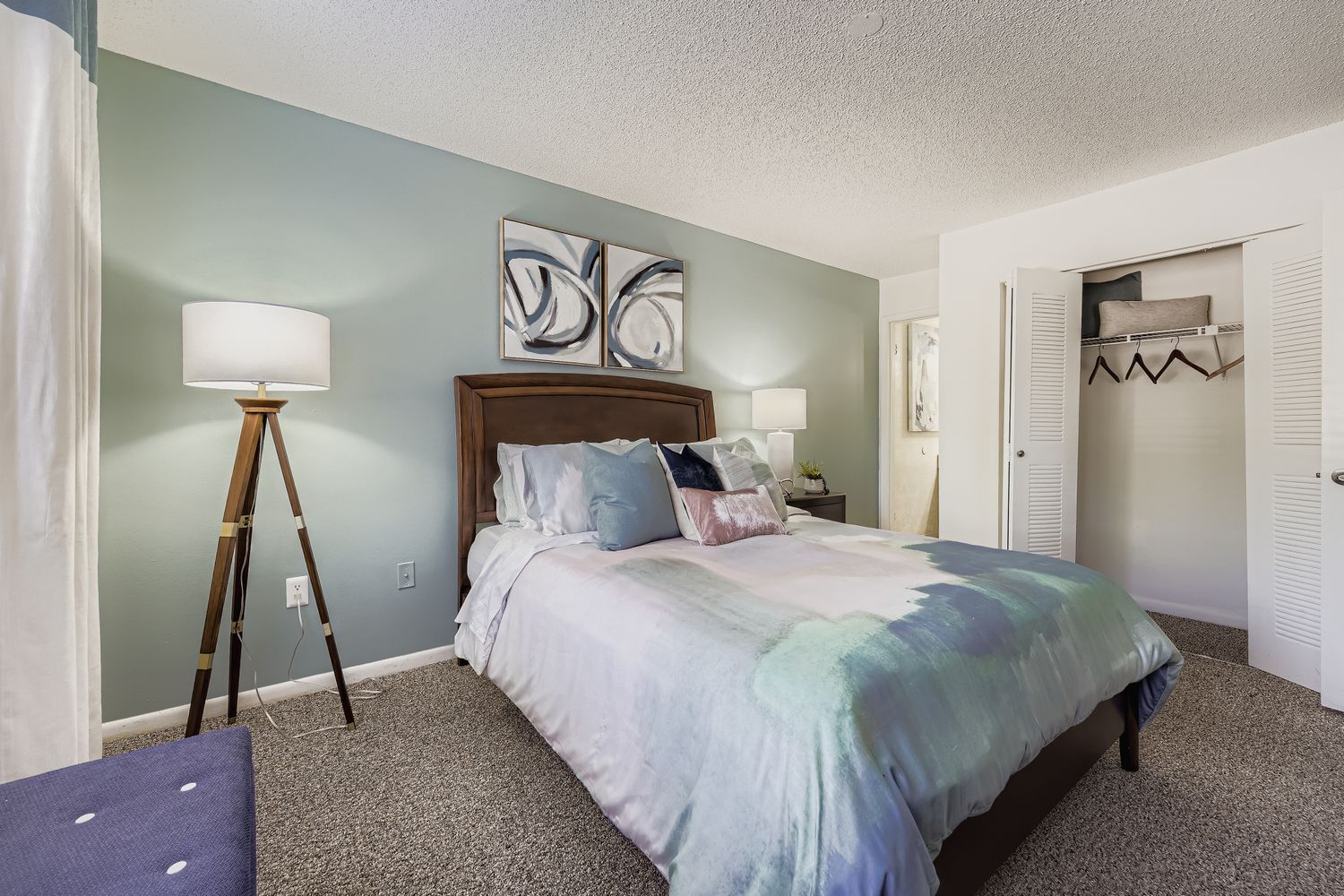 bedroom with bed,side tables, and lamps