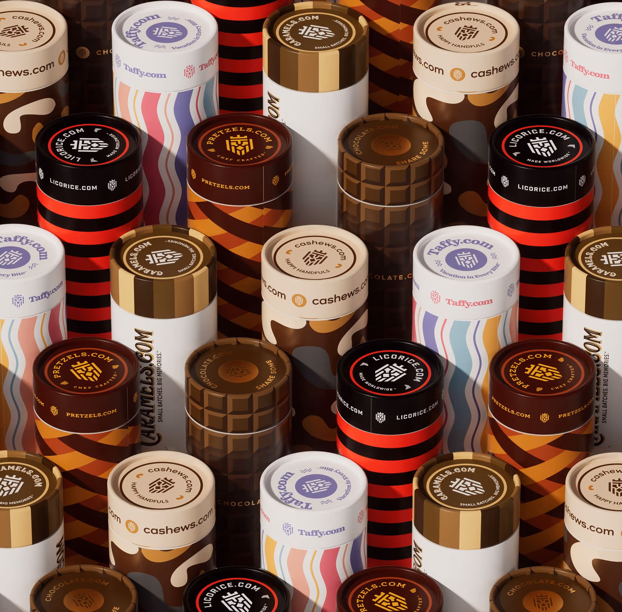 Tightly packed colorful cylindrical candy containers with labels for licorice, cashews, pretzels, and taffy.