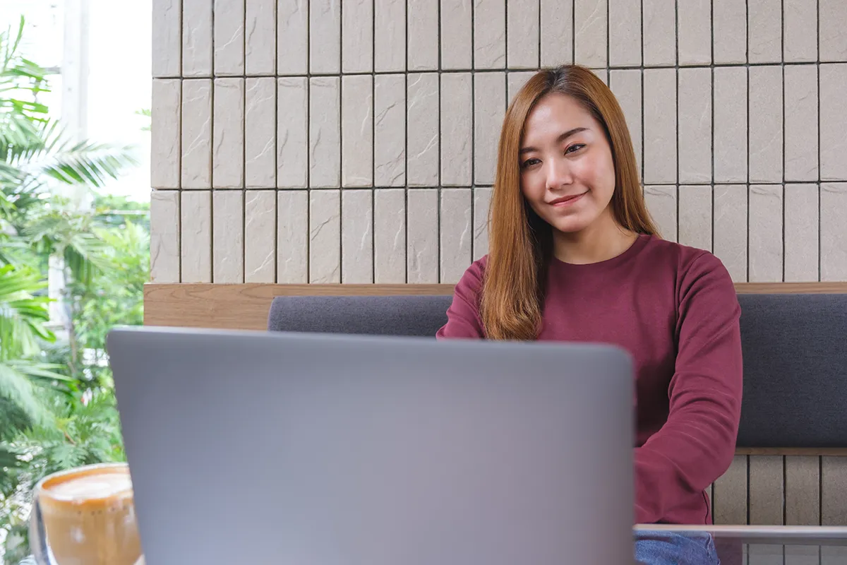 Asian woman working on a laptop