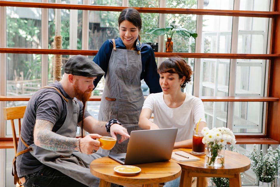 A bustling coffee shop with friendly staff engaging in conversation with customers, highlighting the personal touch in business communication.