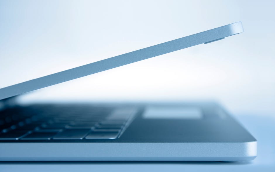 A sleek modern office with a stylish business phone on a polished desk, showcasing its digital screen and AI features, with natural light illuminating the workspace.