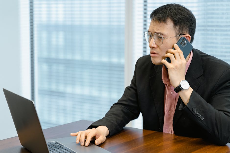 A busy office setting transitioning from human receptionists to an AI interface, highlighting the blend of technology and service.