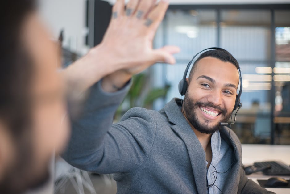 A professional smiling receptionist answering a phone with a headset, surrounded by positive customer feedback and satisfaction metrics displayed on a screen.