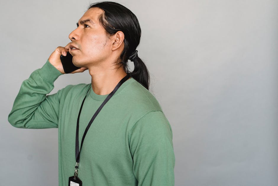 A business professional confidently making a call while utilizing caller ID blocking features on their smartphone.