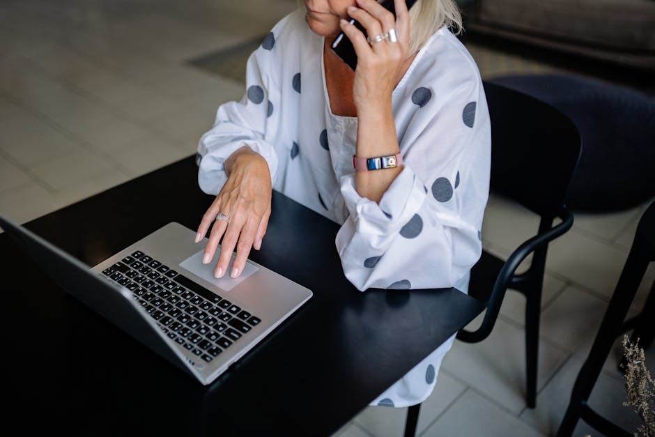 An image depicting a busy professional seamlessly transitioning from a traditional office phone to a cell phone in a modern workspace, with visuals emphasizing connectivity and communication.