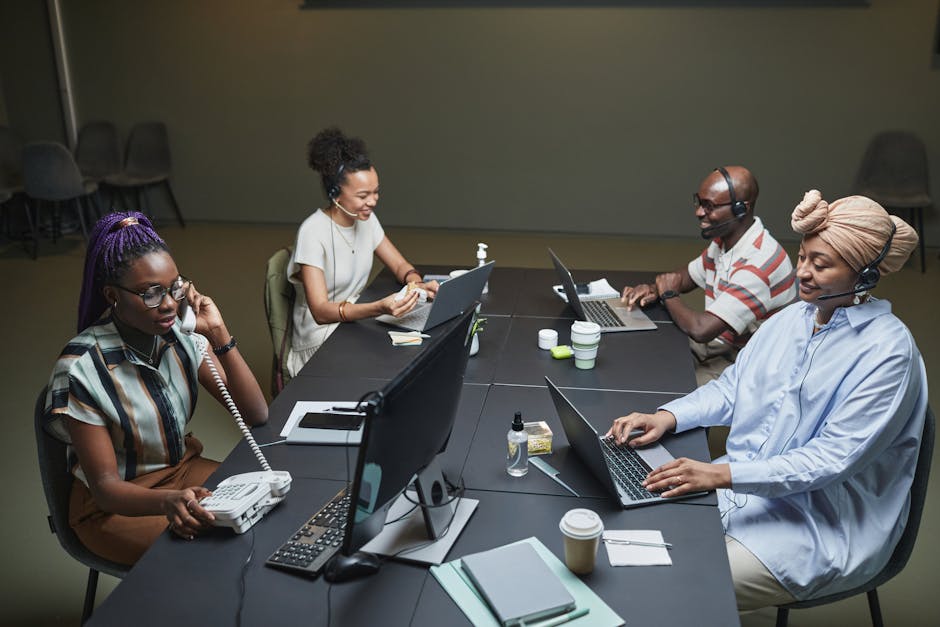 A dynamic graphic depicting a team using computers to make calls, showcasing an interactive digital workspace.