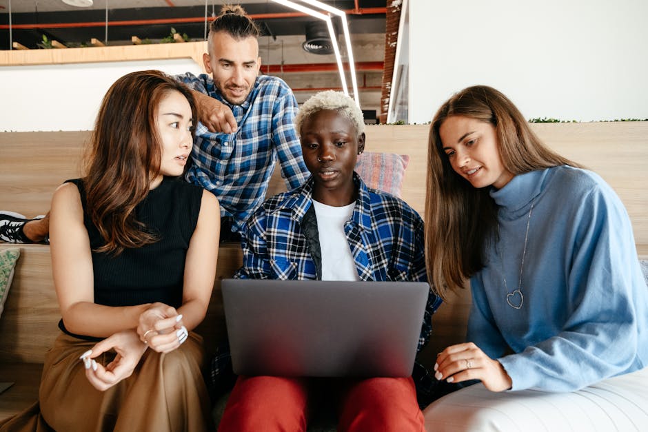 A diverse group of people happily interacting with smart devices, illustrating modern communication.
