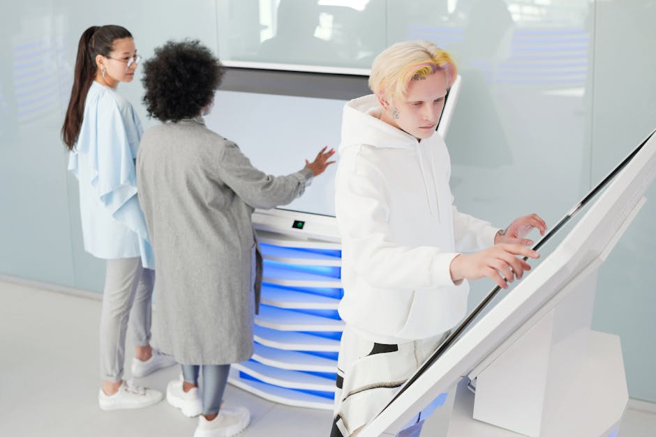 A futuristic office environment showcasing a digital receptionist interacting with clients via holographic display.