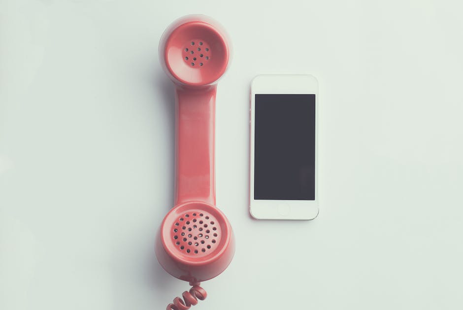 A creative image showing a smartphone displaying a classic landline phone, symbolizing the transfer and evolution of communication methods.