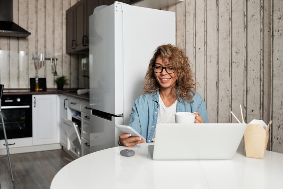 A modern workspace featuring a person effectively handling business communication via mobile and laptop, symbolizing the transition from traditional to mobile communication.