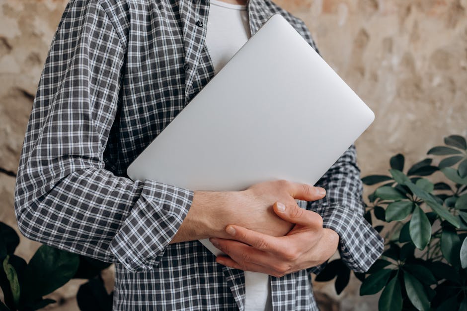 An office environment where a person is using AI technology on a computer for making calls, showcasing a seamless blend of technology and productivity.