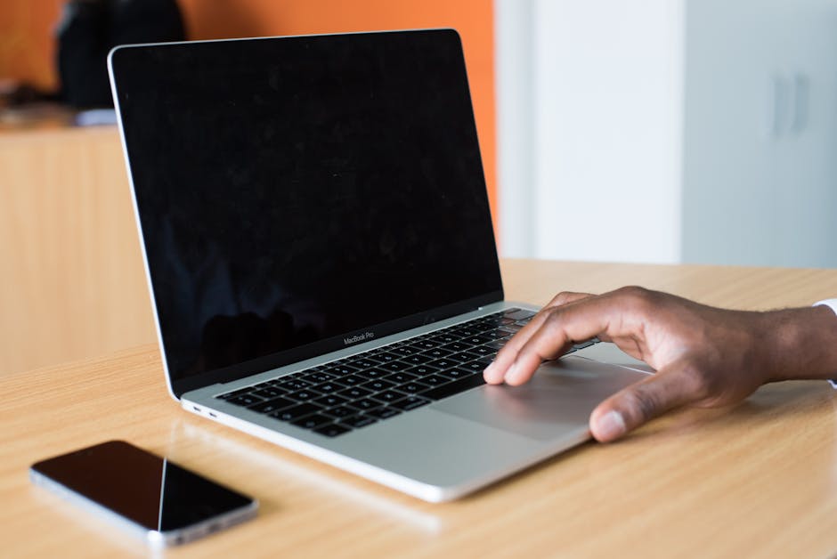 An inviting office space featuring a sleek desk setup with a laptop, a phone, and a calendar planner, symbolizing the harmony between personal and professional communication.