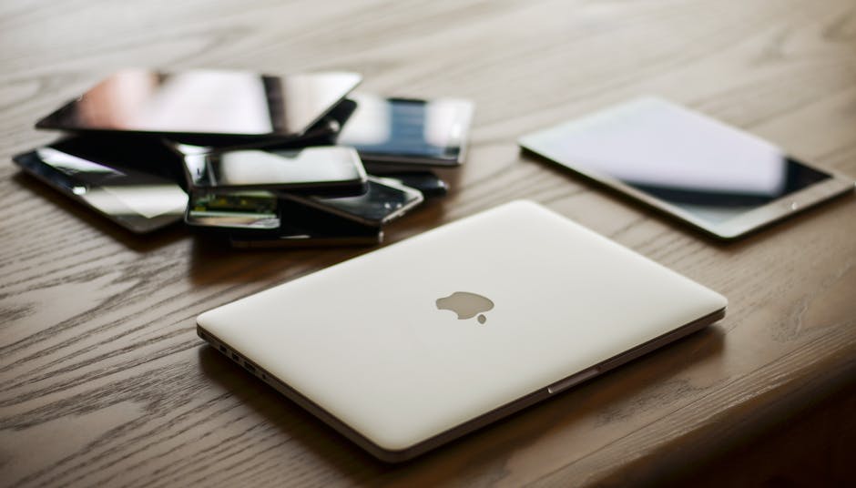 A modern office setup featuring smartphones and laptops, showcasing an active communication environment.