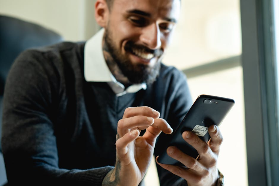 A friendly business representative smiling while texting on a smartphone, conveying approachability and connection