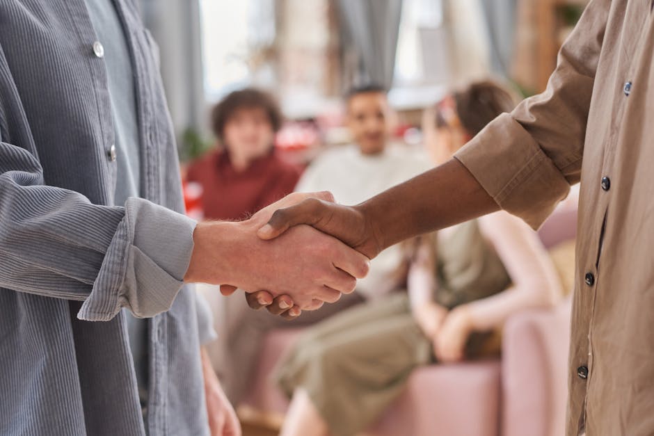 A small business team engaged in a friendly conversation with a customer, showcasing connection and engagement.