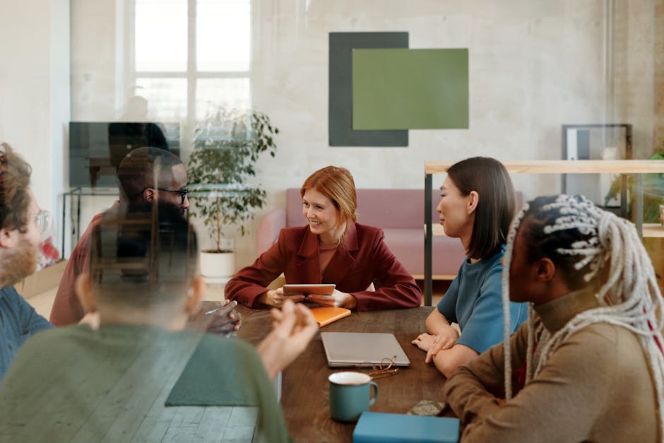 A vibrant office setting with employees engaging through VoIP phones, demonstrating collaboration and modern technology.