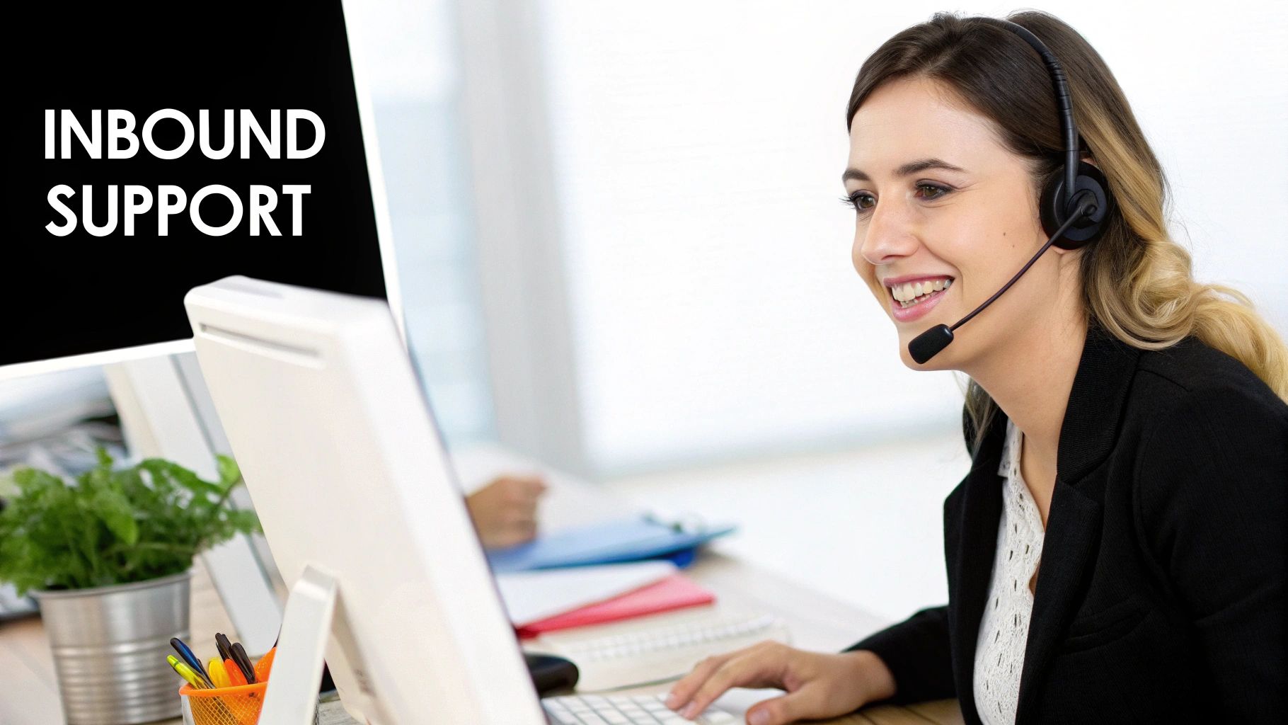 An agent with a headset working in an inbound call center